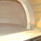 Horno de leña con hornilla con puerta de fundición superior y cristal acabado ladrillo